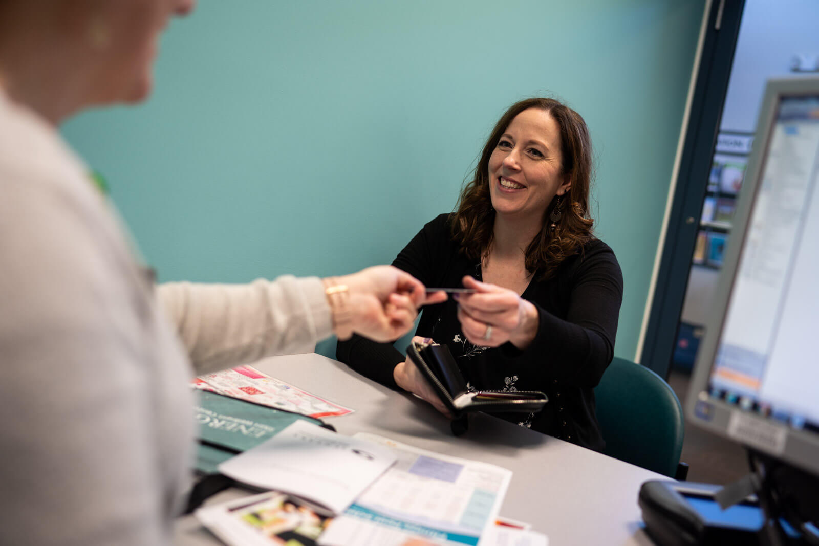 Person joining fitness center and looking at information about the center
