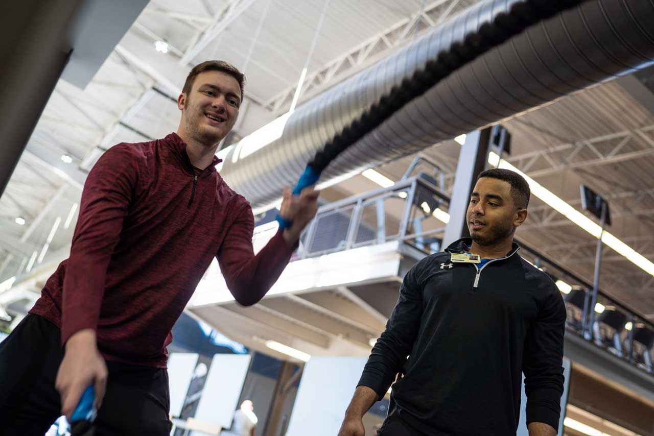 Personal trainer working with a client