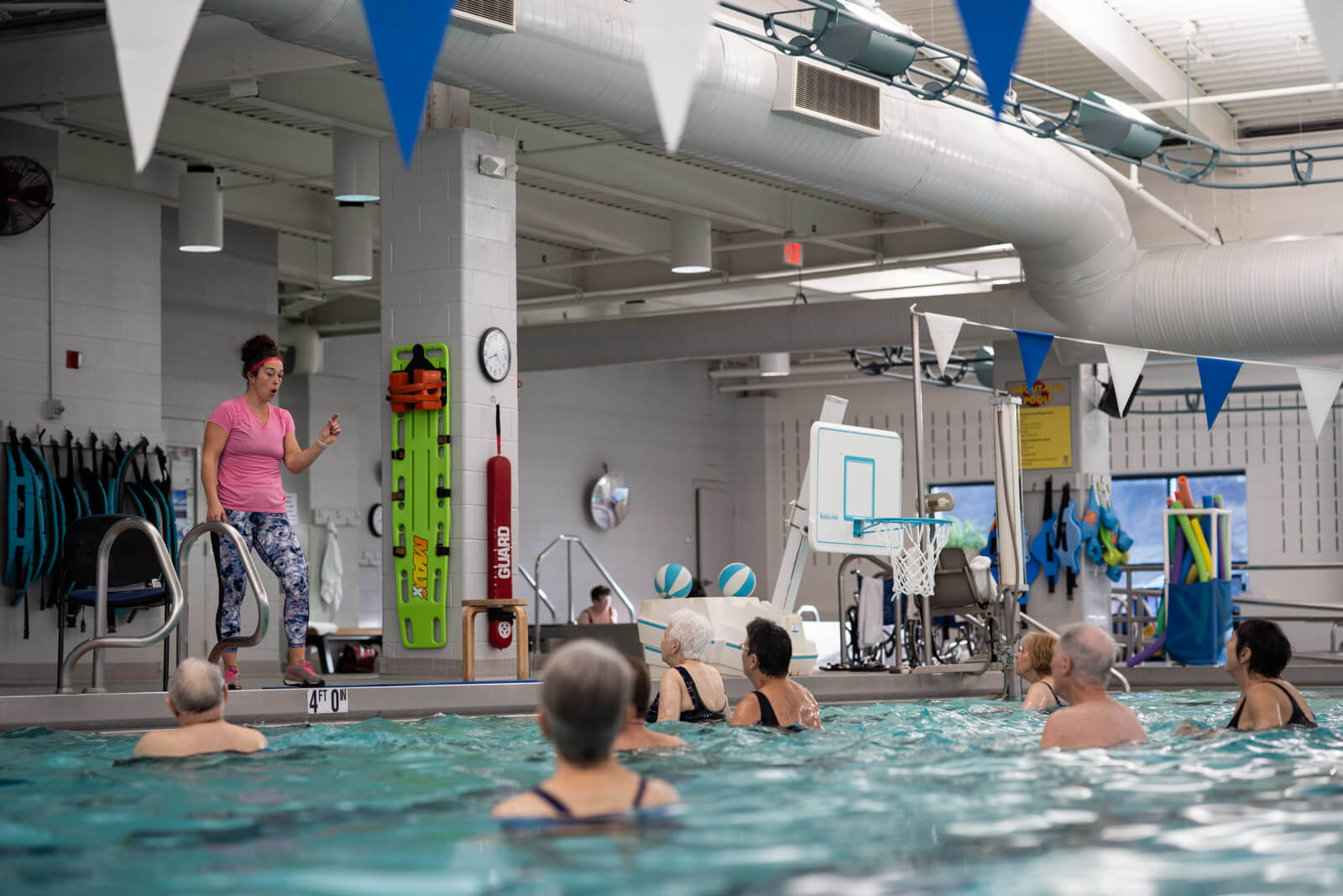 People in pool participating in water aerobics