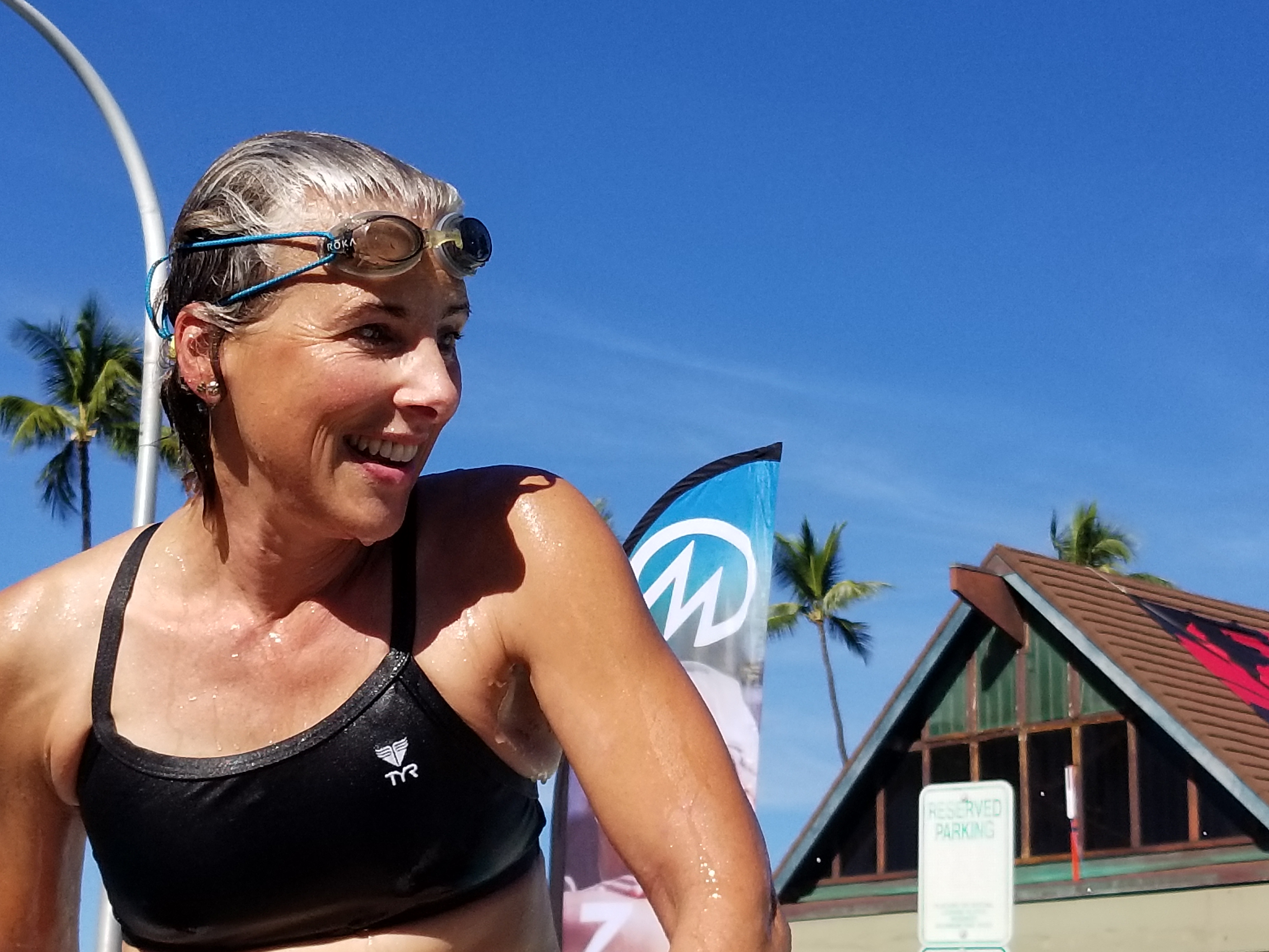 Female at side of the pool during a swim meet