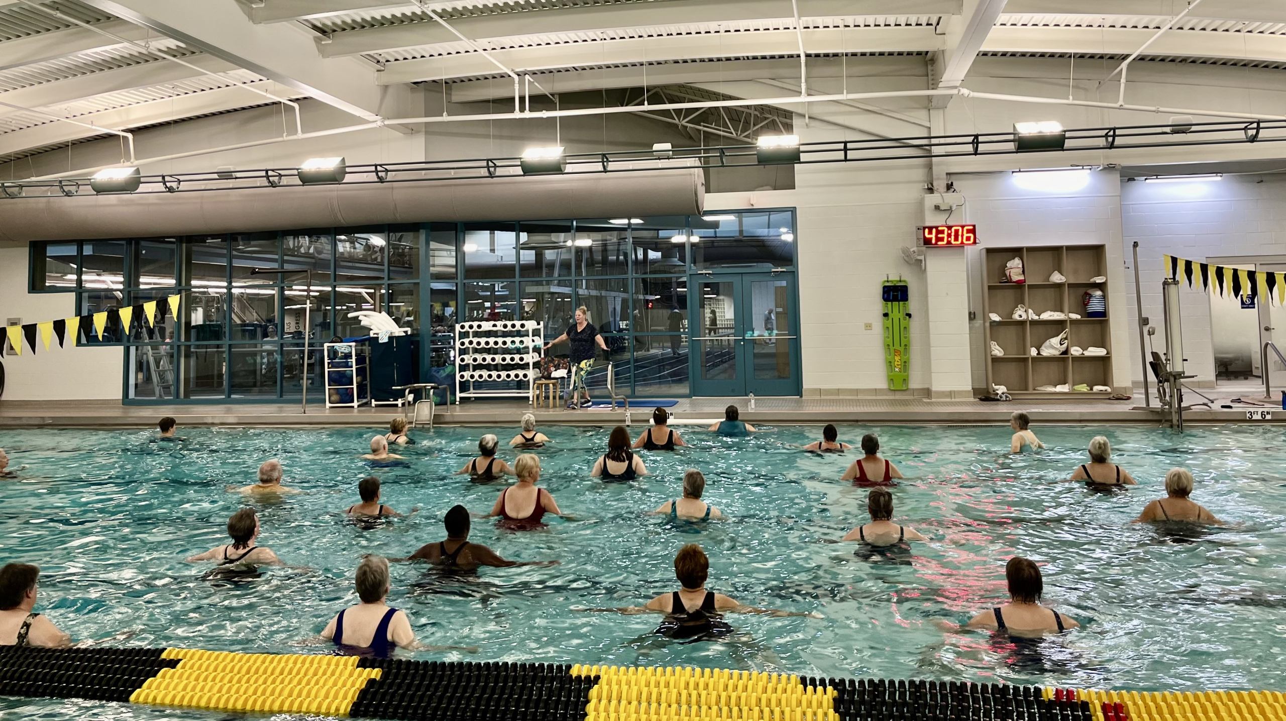 People in pool participating in water aerobics